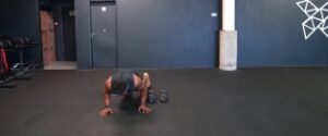 LATERAL BURPEES OVER THE DUMBBELL